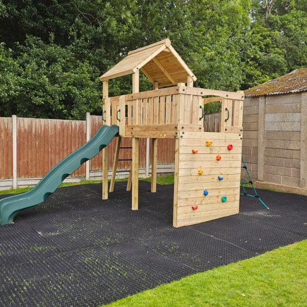 Eastnor Play Tower with ladder, climbing wall, net, and slide. INSTALLED